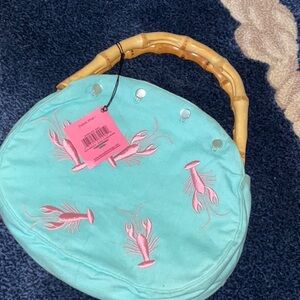 Bamboo handle purse with removable lobster embroidered cover.  Donna Dixon.
